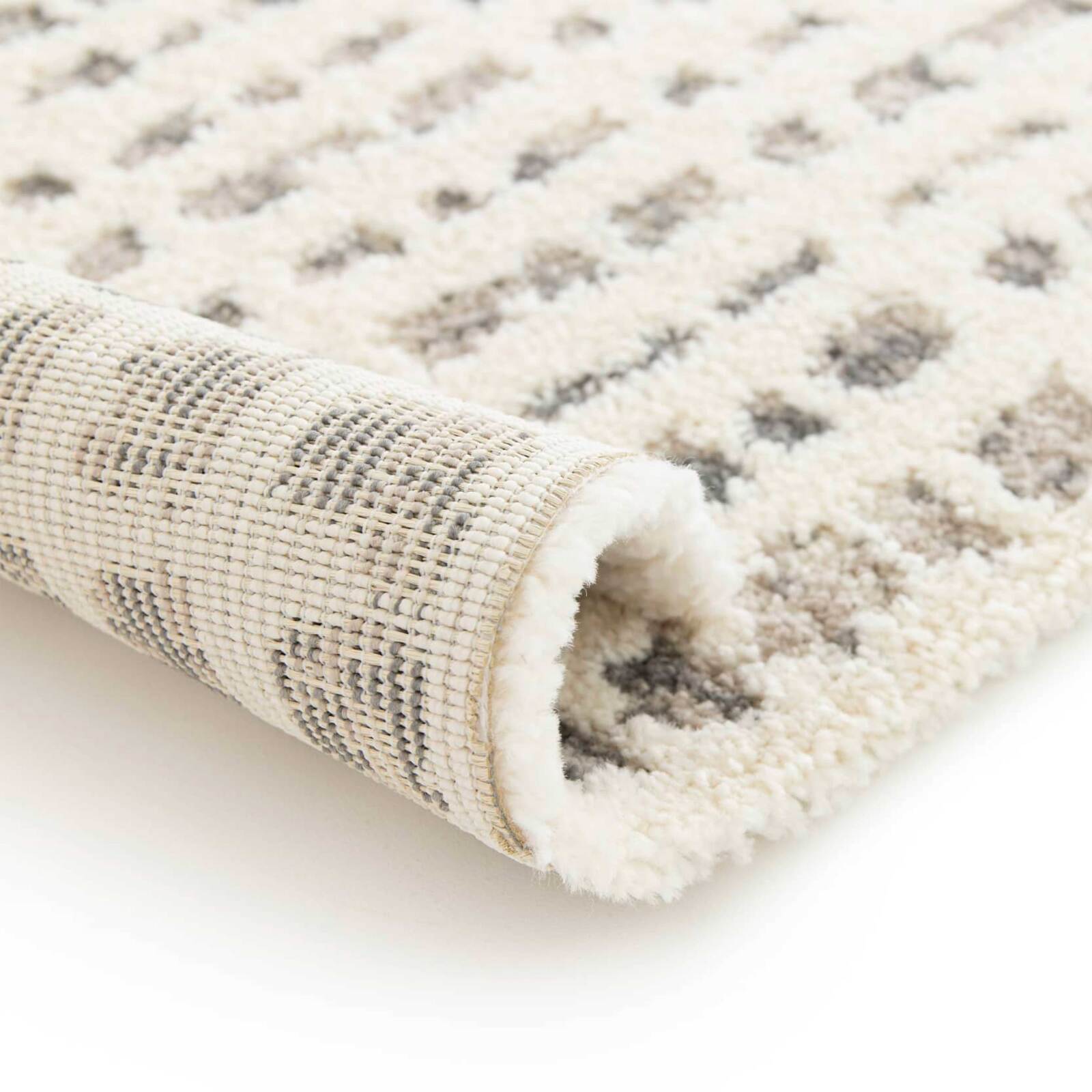 Alfombra shaggy rectangular de poliéster y polipropileno.