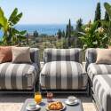 Sofá modular de exterior a rayas para 4 personas con estructura, 3 sillones, 1 puf, y mesa de centro