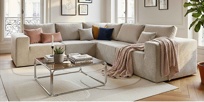 Sofá modular de tela con mesa de centro con tablero de vidrio templado