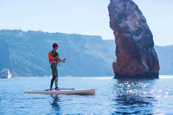 Pescador en paddle